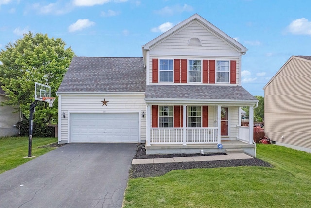 traditional home featuring covered porch, asphalt driveway, a front lawn, a garage, and a shingled roof