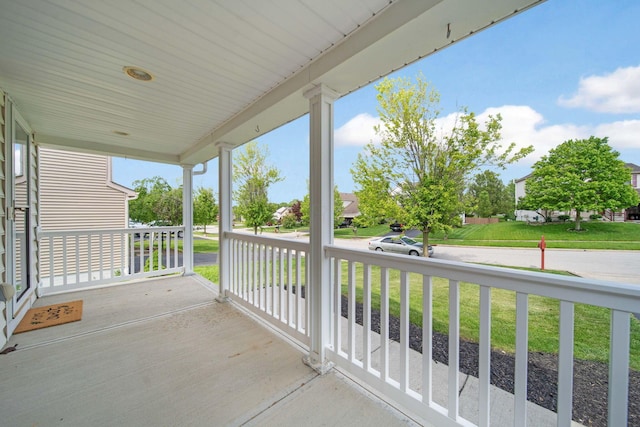 balcony with a porch and a water view