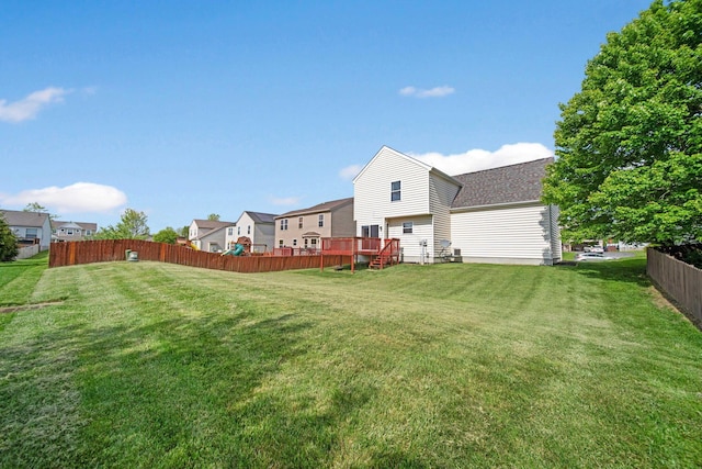 view of yard with a wooden deck