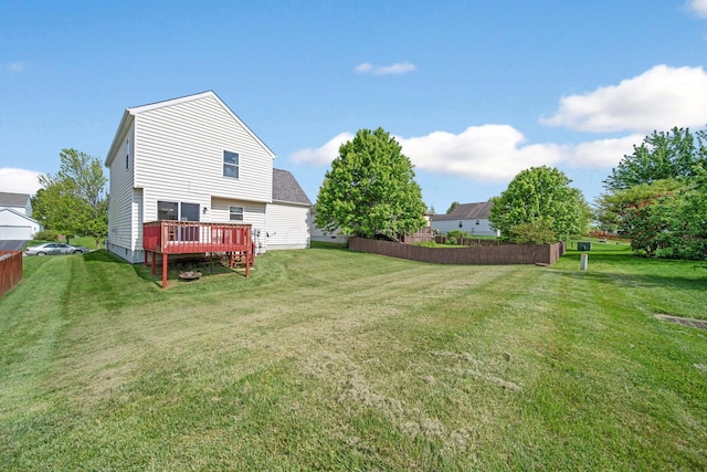 view of yard with a wooden deck