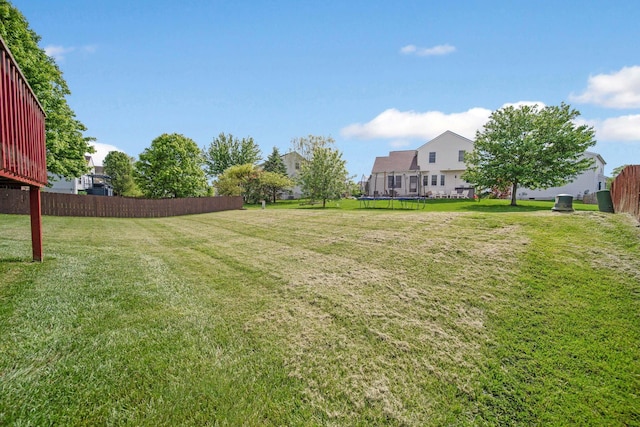 view of yard with a trampoline