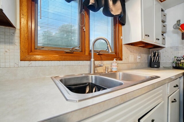 700 Taylor Blair Rd, West Jefferson, OH 43162 - kitchen with a sink, light countertops, backsplash, and white cabinetry