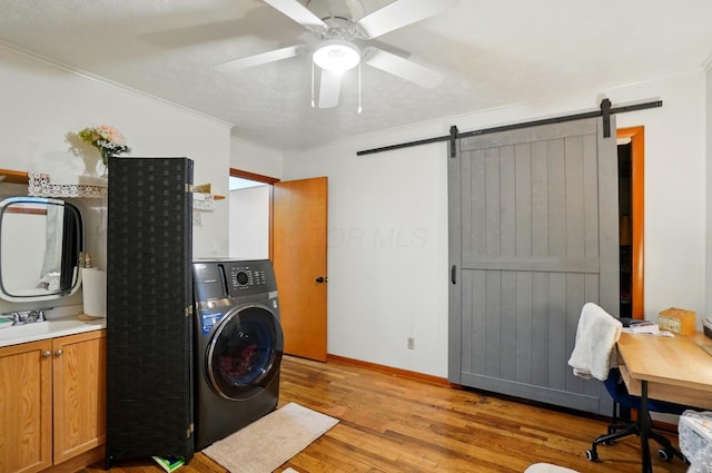 700 Taylor Blair Rd, West Jefferson, OH 43162 - laundry room with washer / clothes dryer, a barn door, light wood-style flooring, ceiling fan, and ornamental molding