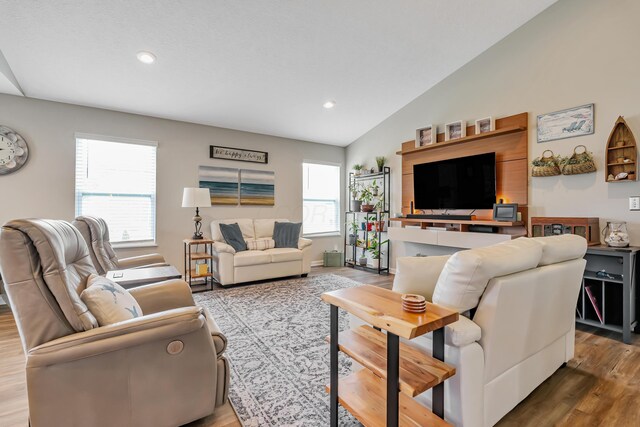 6922 Duke Dr, Canal Winchester, OH 43110 - living area featuring wood finished floors, recessed lighting, and lofted ceiling