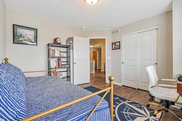6922 Duke Dr, Canal Winchester, OH 43110 - bedroom featuring wood finished floors, a closet, and baseboards
