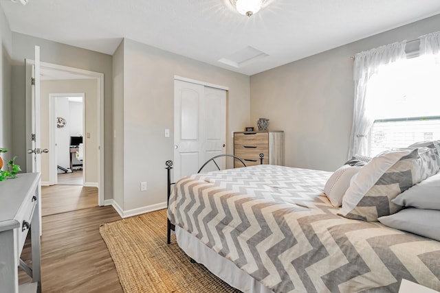 6922 Duke Dr, Canal Winchester, OH 43110 - bedroom featuring wood finished floors, baseboards, and a closet