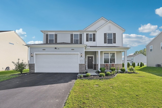 3321 Butternut Ln, Hebron, OH 43025 - craftsman inspired home featuring driveway, a porch, board and batten siding, a front lawn, and stone siding