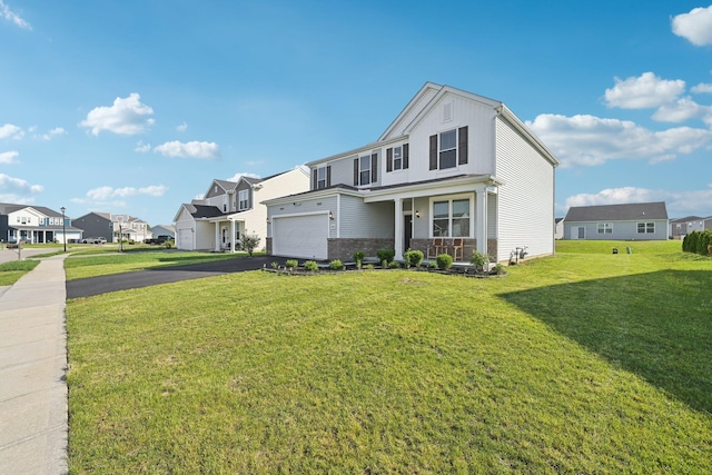 3321 Butternut Ln, Hebron, OH 43025 - view of front of home with a residential view, driveway, an attached garage, and a front yard