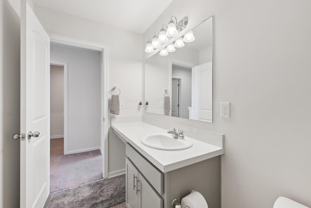 3321 Butternut Ln, Hebron, OH 43025 - half bathroom with vanity, baseboards, and toilet