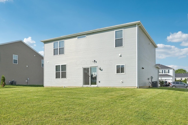 3321 Butternut Ln, Hebron, OH 43025 - back of property with central air condition unit and a lawn