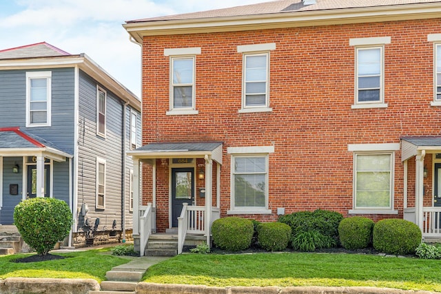 684 Hamlet St, Columbus, OH 43215 - view of front of property with brick siding and a front lawn