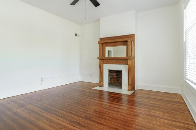 684 Hamlet St, Columbus, OH 43215 - unfurnished living room featuring a ceiling fan, a fireplace with flush hearth, baseboards, and hardwood / wood-style flooring