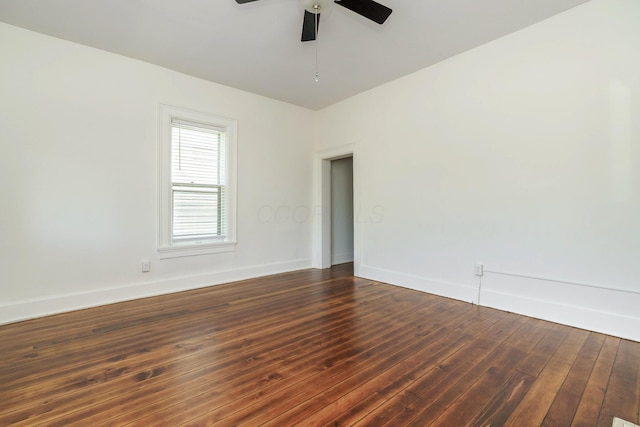 684 Hamlet St, Columbus, OH 43215 - unfurnished room with baseboards, dark wood-style flooring, and ceiling fan