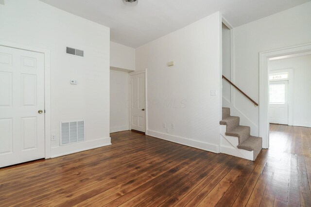 684 Hamlet St, Columbus, OH 43215 - spare room featuring stairway, hardwood / wood-style flooring, and baseboards