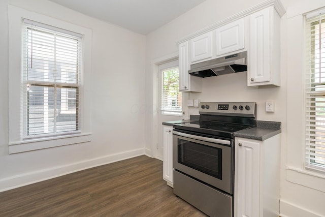 684 Hamlet St, Columbus, OH 43215 - kitchen with under cabinet range hood, stainless steel electric range, dark countertops, white cabinets, and dark wood-style floors