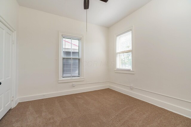 684 Hamlet St, Columbus, OH 43215 - carpeted spare room with ceiling fan and baseboards