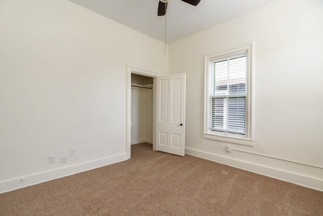 684 Hamlet St, Columbus, OH 43215 - unfurnished bedroom with carpet flooring, baseboards, and a ceiling fan