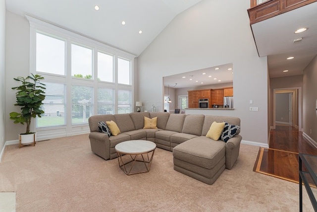 1338 Elkhorn Dr, Blacklick, OH 43004 - carpeted living room with high vaulted ceiling, recessed lighting, and baseboards