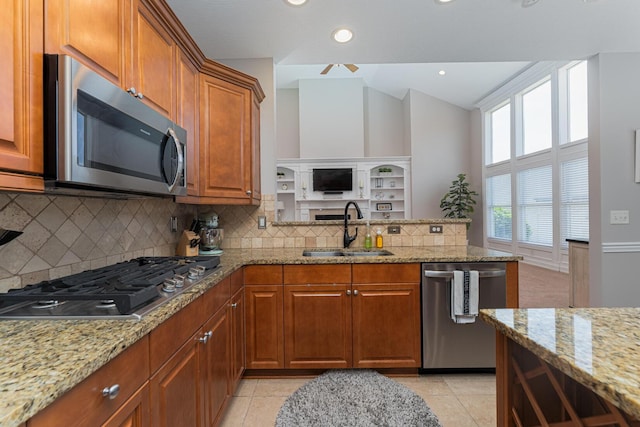 1338 Elkhorn Dr, Blacklick, OH 43004 - kitchen with appliances with stainless steel finishes, a sink, brown cabinets, light stone countertops, and backsplash