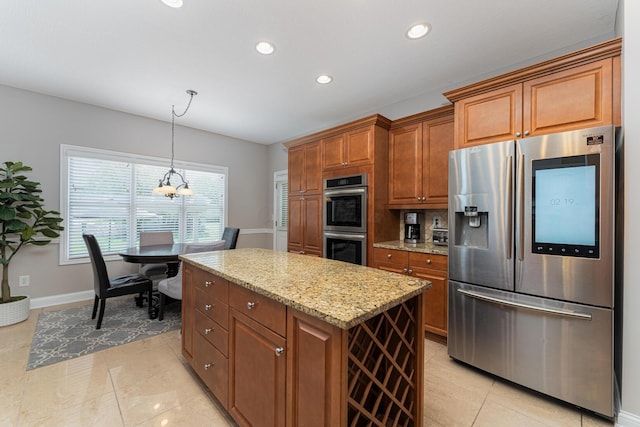 1338 Elkhorn Dr, Blacklick, OH 43004 - kitchen with stainless steel appliances, light stone countertops, baseboards, brown cabinets, and recessed lighting