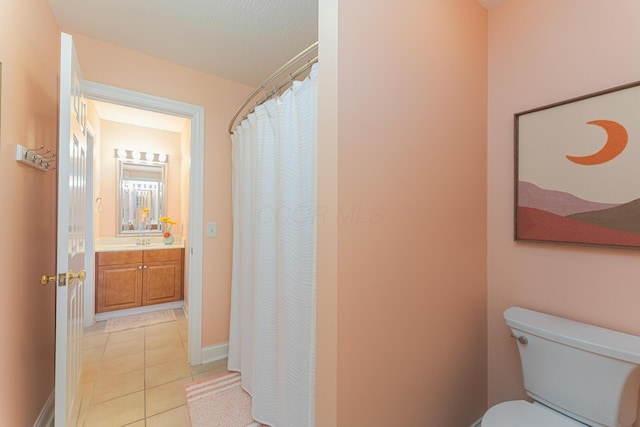1338 Elkhorn Dr, Blacklick, OH 43004 - bathroom with tile patterned flooring, toilet, vanity, baseboards, and a shower with shower curtain