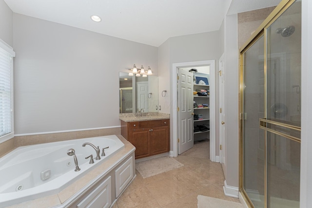 1338 Elkhorn Dr, Blacklick, OH 43004 - bathroom featuring a shower stall, vanity, a walk in closet, and a whirlpool tub