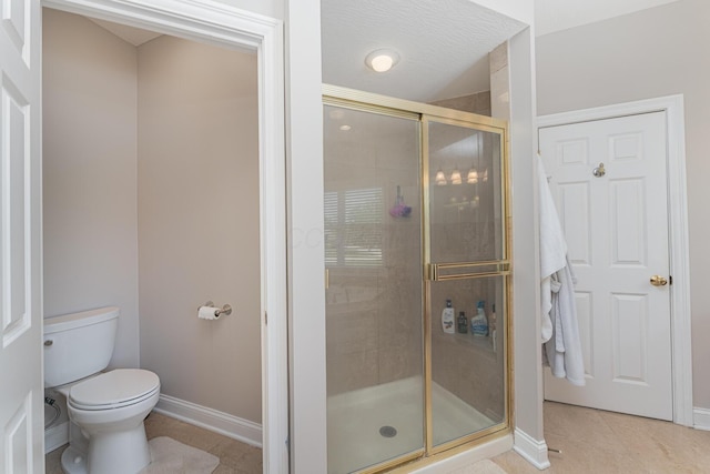 1338 Elkhorn Dr, Blacklick, OH 43004 - bathroom featuring a shower stall, baseboards, tile patterned flooring, and toilet