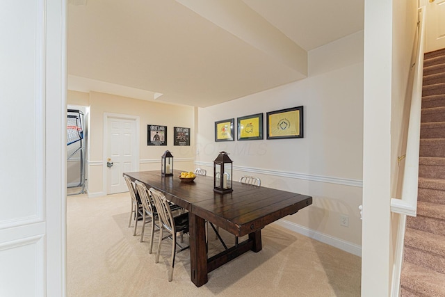 1338 Elkhorn Dr, Blacklick, OH 43004 - dining area featuring stairway, light carpet, and baseboards