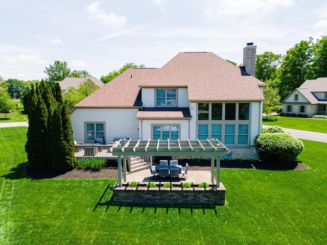 1338 Elkhorn Dr, Blacklick, OH 43004 - rear view of property featuring a chimney, a yard, stucco siding, a patio, and a deck