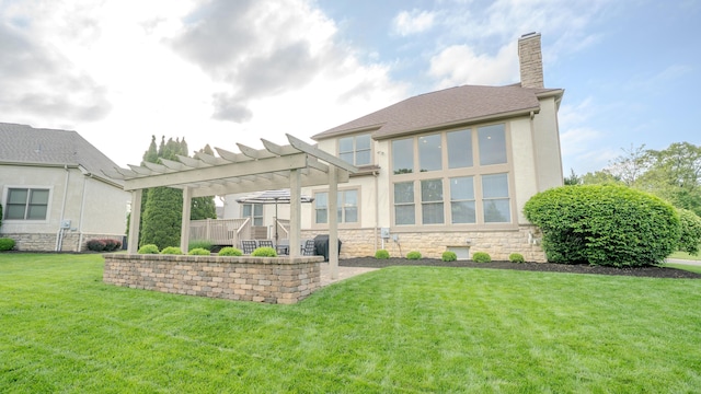 1338 Elkhorn Dr, Blacklick, OH 43004 - back of house with a pergola, stone siding, a lawn, a chimney, and stucco siding