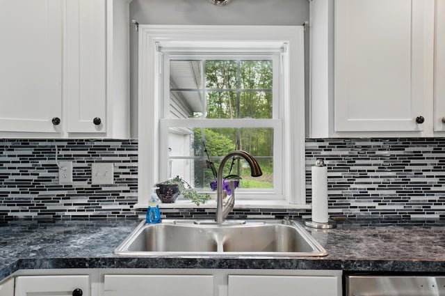 9820 Heimberger Rd NW, Baltimore, OH 43105 - kitchen with a sink, dark countertops, white cabinetry, stainless steel dishwasher, and tasteful backsplash