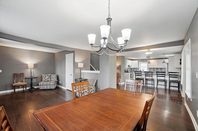 9820 Heimberger Rd NW, Baltimore, OH 43105 - dining room with a chandelier, dark wood-style flooring, and baseboards
