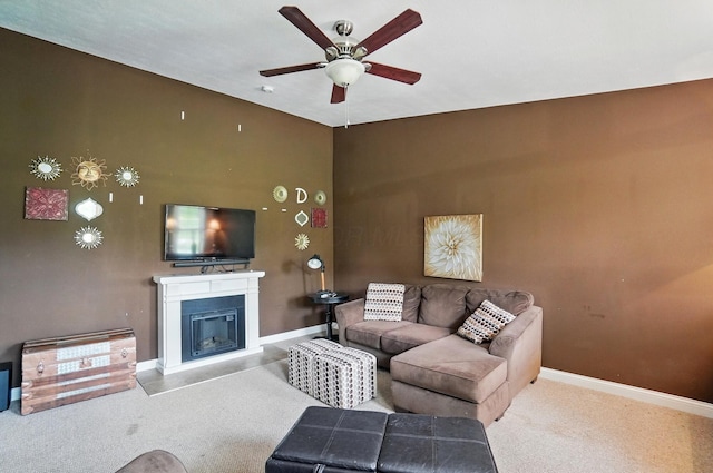 9820 Heimberger Rd NW, Baltimore, OH 43105 - living room featuring a ceiling fan, baseboards, a glass covered fireplace, and carpet