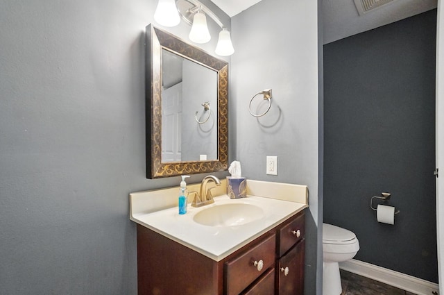 9820 Heimberger Rd NW, Baltimore, OH 43105 - half bathroom featuring vanity, toilet, and baseboards