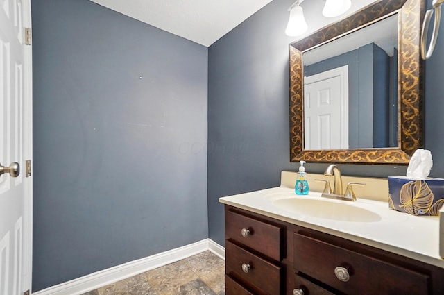 9820 Heimberger Rd NW, Baltimore, OH 43105 - bathroom featuring baseboards, vanity, and stone finish floors