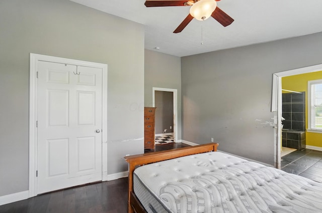 9820 Heimberger Rd NW, Baltimore, OH 43105 - bedroom with baseboards, wood finished floors, ensuite bath, and a ceiling fan