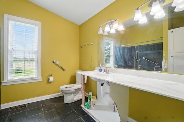 9820 Heimberger Rd NW, Baltimore, OH 43105 - full bath featuring healthy amount of natural light, tile patterned floors, toilet, vaulted ceiling, and tiled shower