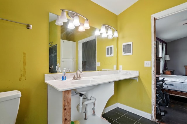 9820 Heimberger Rd NW, Baltimore, OH 43105 - bathroom featuring toilet, baseboards, tile patterned floors, and a sink