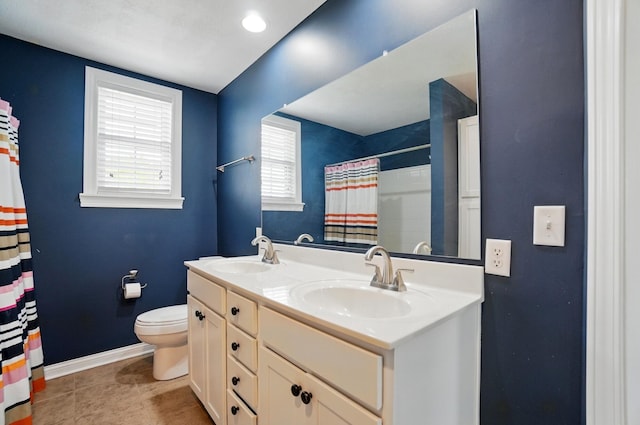 9820 Heimberger Rd NW, Baltimore, OH 43105 - bathroom featuring toilet, baseboards, double vanity, tile patterned floors, and a shower with curtain