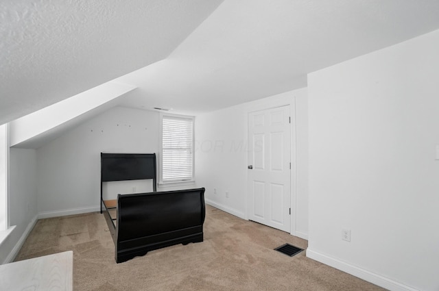 9820 Heimberger Rd NW, Baltimore, OH 43105 - unfurnished bedroom featuring carpet, vaulted ceiling, and baseboards