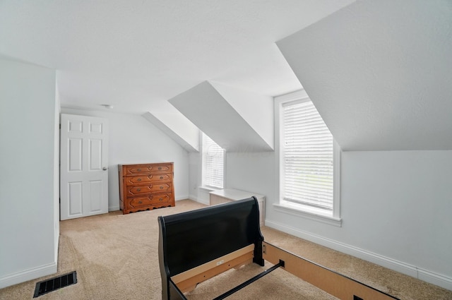 9820 Heimberger Rd NW, Baltimore, OH 43105 - bedroom with carpet floors, vaulted ceiling, and baseboards