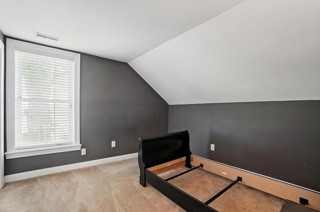 9820 Heimberger Rd NW, Baltimore, OH 43105 - unfurnished bedroom featuring carpet flooring, baseboards, and vaulted ceiling
