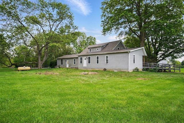 9820 Heimberger Rd NW, Baltimore, OH 43105 - rear view of house with a lawn and a wooden deck