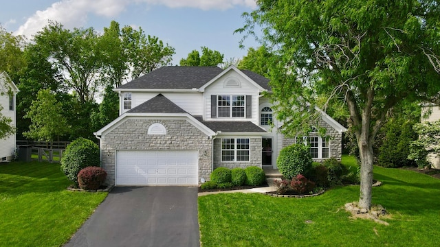 1908 Baltic Ave, Lewis Center, OH 43035 - traditional-style house featuring stone siding, driveway, a garage, and a shingled roof