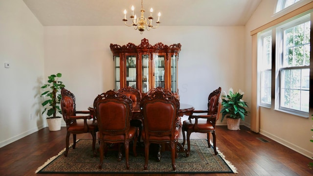 1908 Baltic Ave, Lewis Center, OH 43035 - dining room with a chandelier, baseboards, dark wood finished floors, and vaulted ceiling