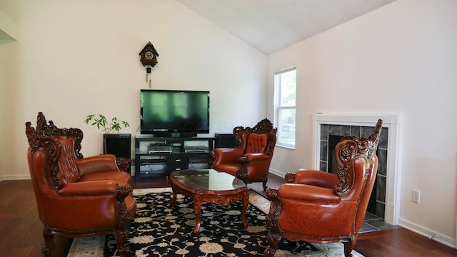 1908 Baltic Ave, Lewis Center, OH 43035 - living area with wood finished floors, lofted ceiling, baseboards, and a tile fireplace