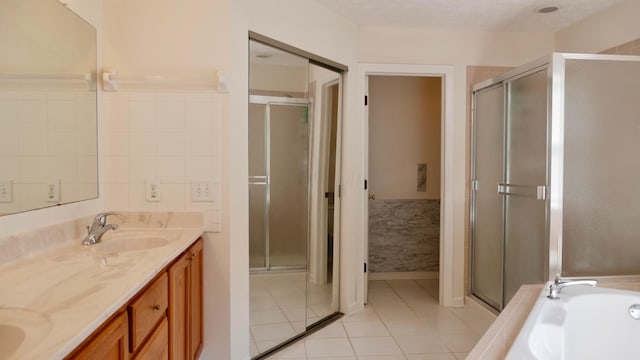 1908 Baltic Ave, Lewis Center, OH 43035 - bathroom with tile patterned flooring, a shower stall, double vanity, and a garden tub