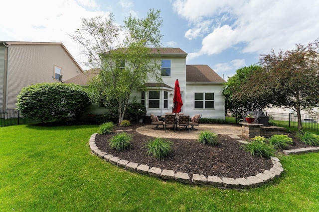 back of property with a patio