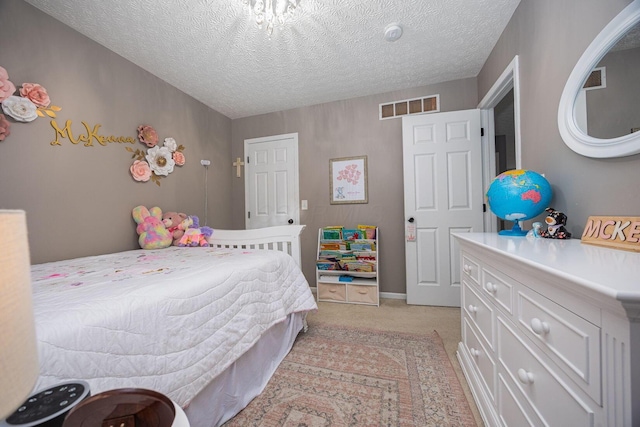 3409 Marl Pl, Columbus, OH 43221 - bedroom with light colored carpet and a textured ceiling