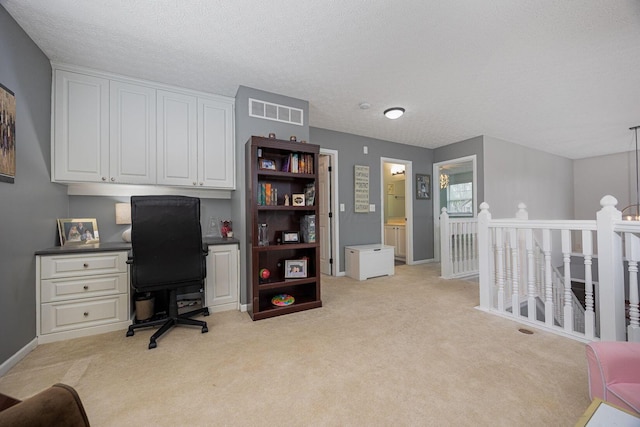 3409 Marl Pl, Columbus, OH 43221 - office area featuring light carpet, a textured ceiling, and baseboards